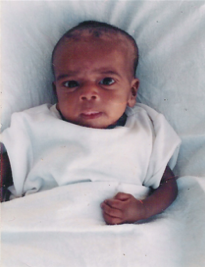 African baby in white clothing
