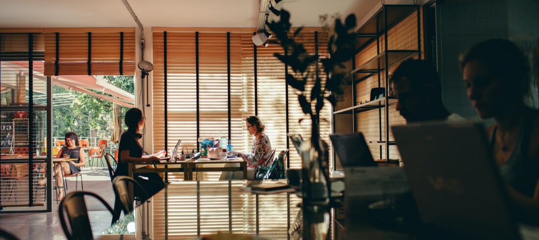 People in cafe on laptops