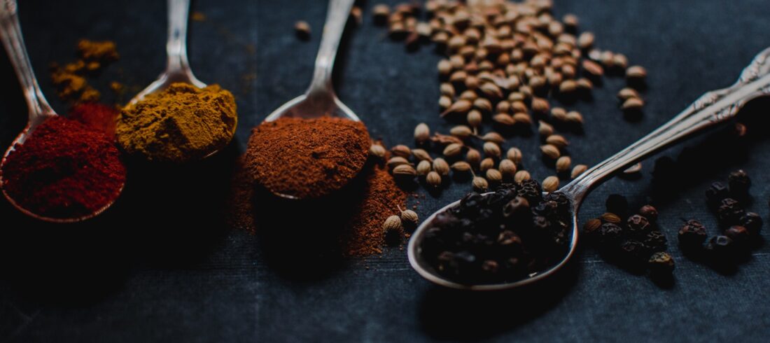 Four Spoons with Indian spices overflowing