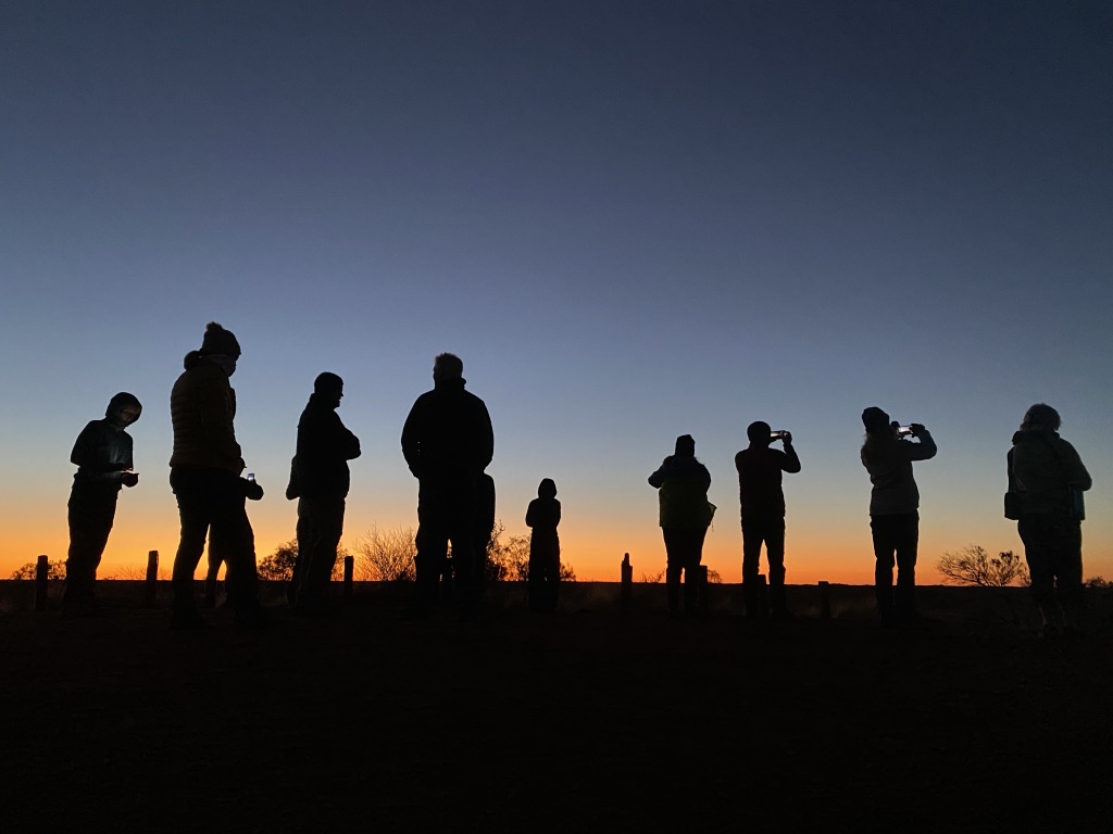 Silhouette of people waiting for sunrise