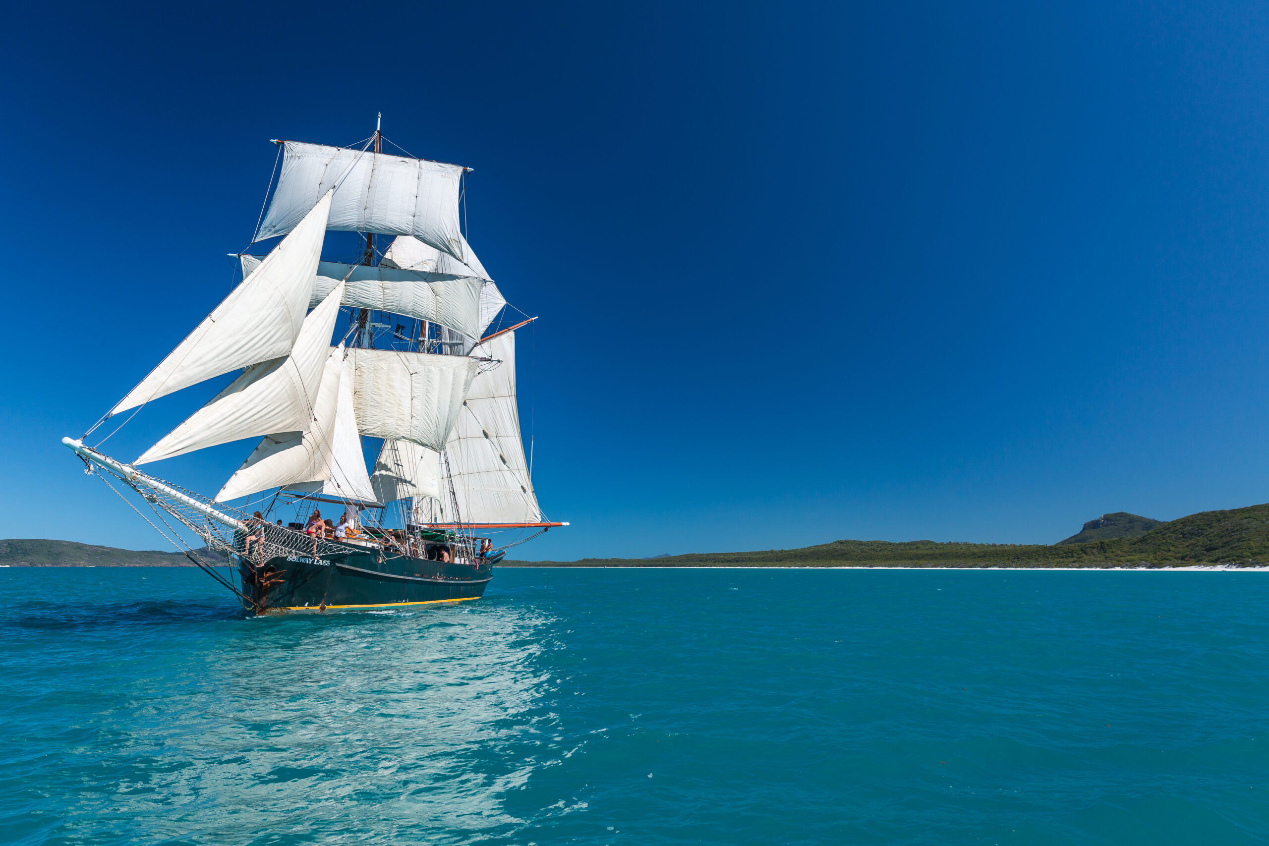 Tall ship with sails up