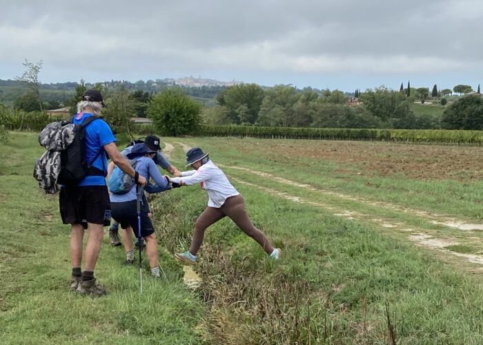 Hikers helping each other